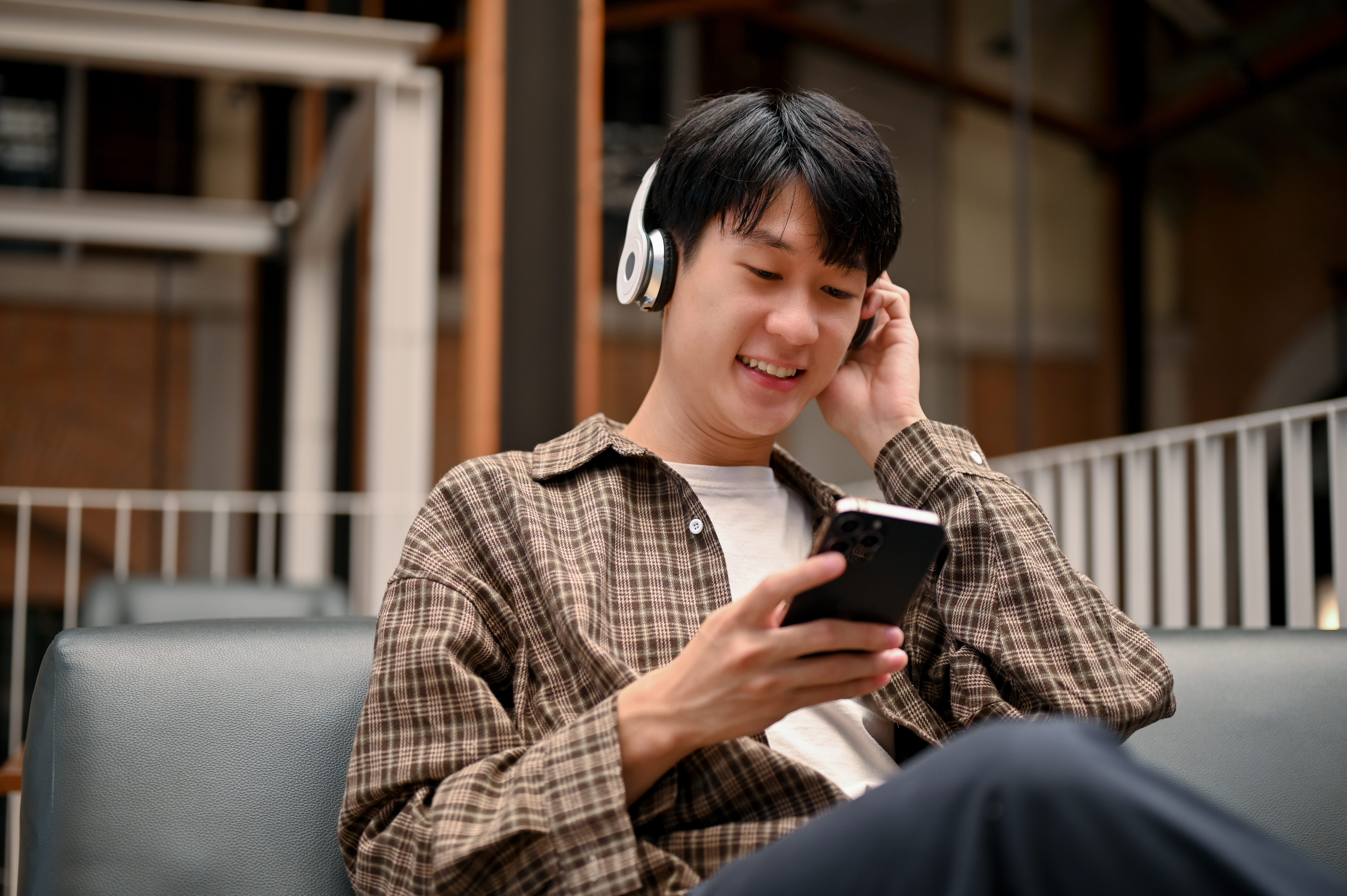 Listening with headphones while using a phone.
